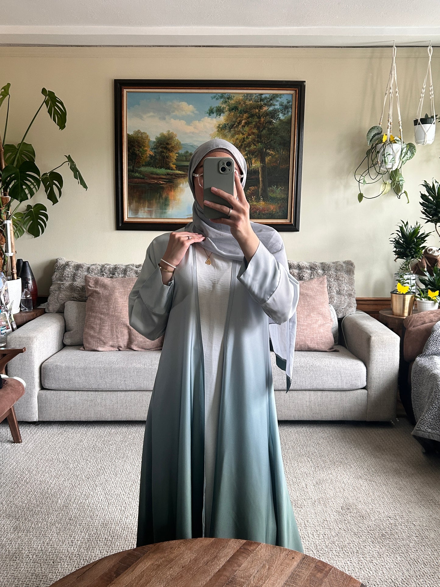 Elegant green abaya showcasing modest clothing style for contemporary fashion lovers.