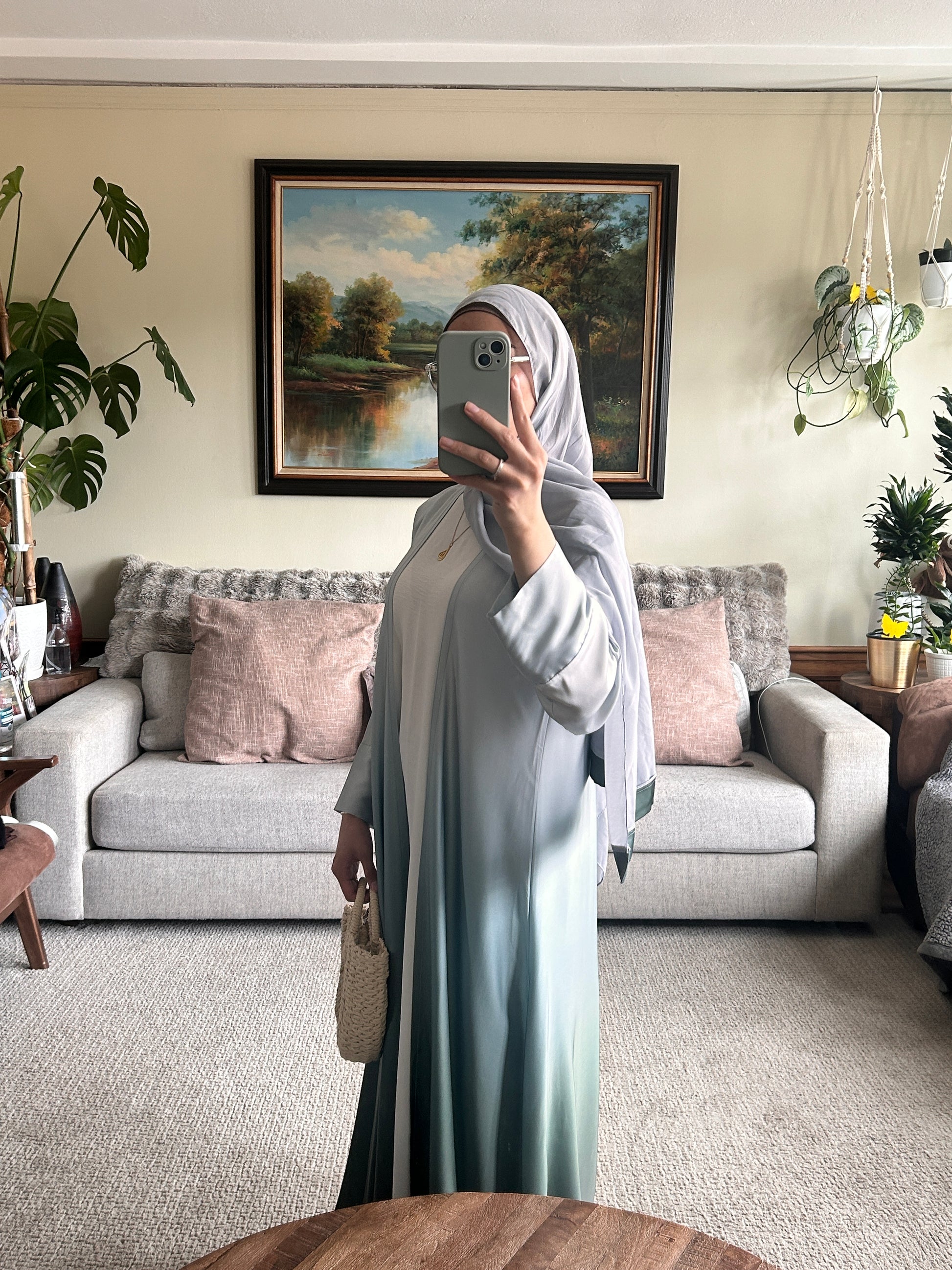 Elegant green abaya showcasing modest clothing style for contemporary fashion lovers.